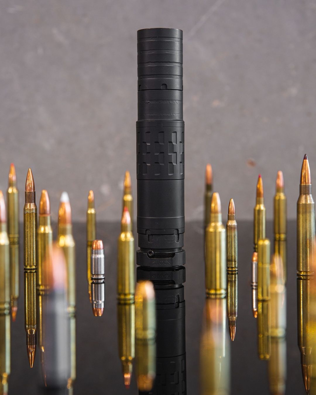 suppressor/silencer surrounded by ammunition cane creek munitions