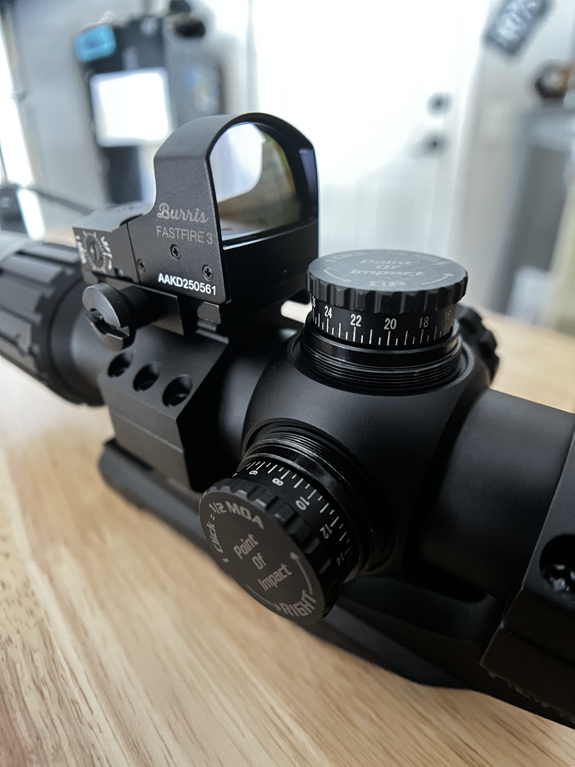 Close up shot of the Burris RT-6 adjustment knobs and top mount red dot. burris rt-6 rifle scope on AR-15